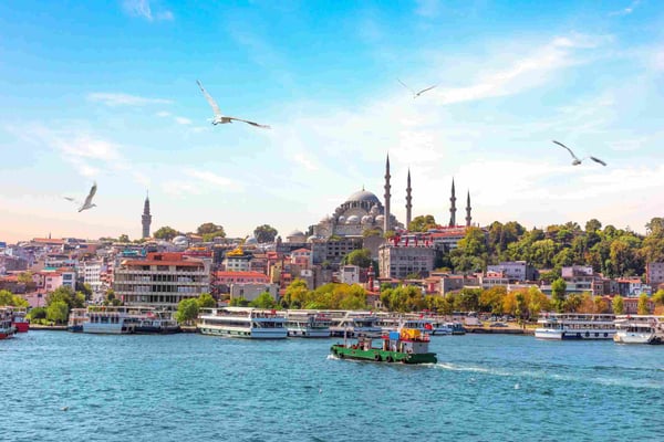 Eminonu Pier and Suleymaniye Mosque in Istanbul Turkey