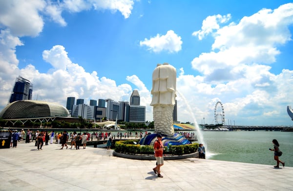 Tourists visit The Merlion at Marina Bay in Singapore