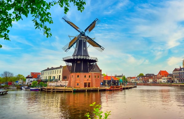 a windmill along the canals in haarlem netherlands on a clear day