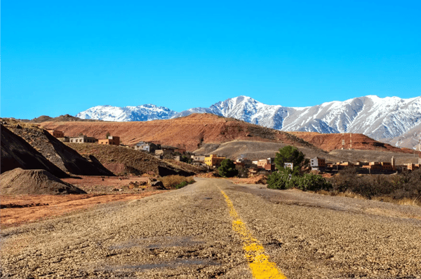african road through the atlas mountains to the sahara desert