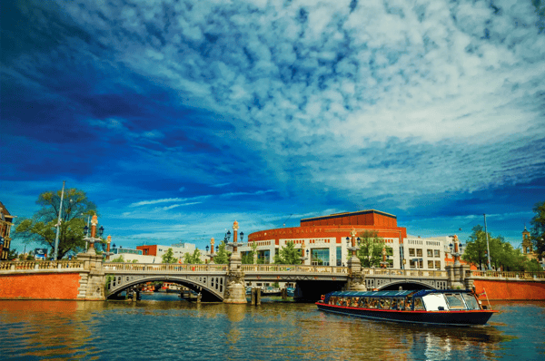 amsterdam northern netherlands boat and bridge in front of the dutch national opera 