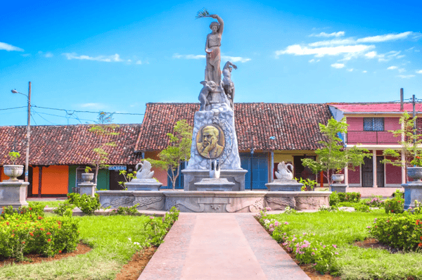 ancient stone columns lining the walkway in the parque xalteva park in downtown granada nicaragua