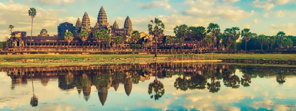 angkor wat temple reflecting in water of lotus pond at sunset siem reap cambodia panorama