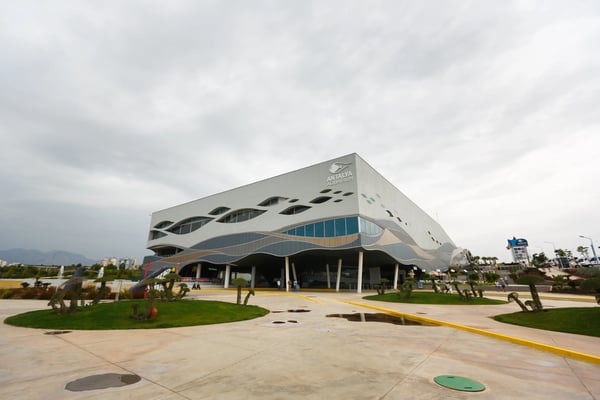 antalya aquarium building with a fountain in the foreground
