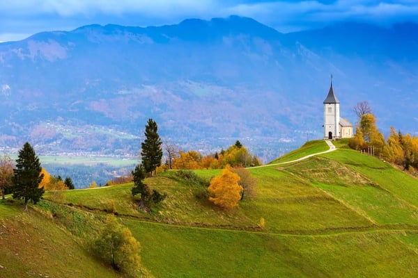 autumn panorama with saints primus and felician church on top of hill in slovenian countryside 