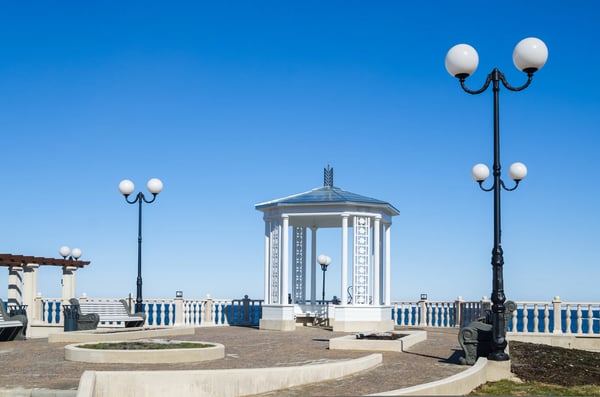 beautiful romantic gazebo in the park on blue sky background