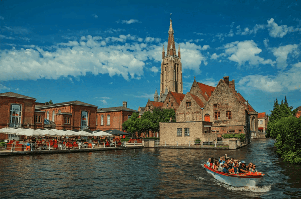 bruges belgium boat and old buildings on the canal s edge at bruges 