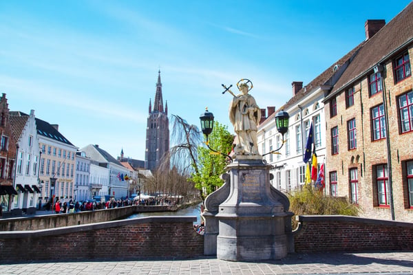 bruges belgium scenic cityscape with houses statue of johannes nepomucenus church 