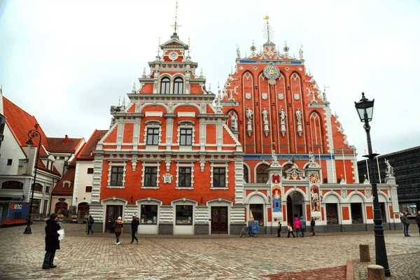 building on the street of old part of riga city in cloudy spring day