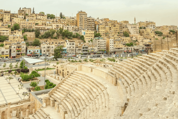 cityscape of amman capital of jordan with the roman amphitheatre in the front 