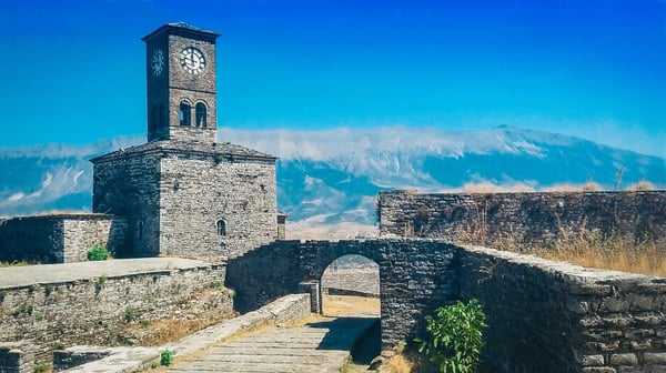 clock tower on top of the fortress in beautiful cityscape