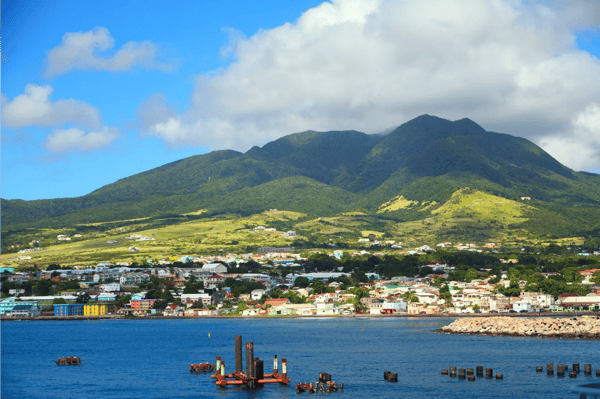 colorful homes under green hills saint kitts and nevis