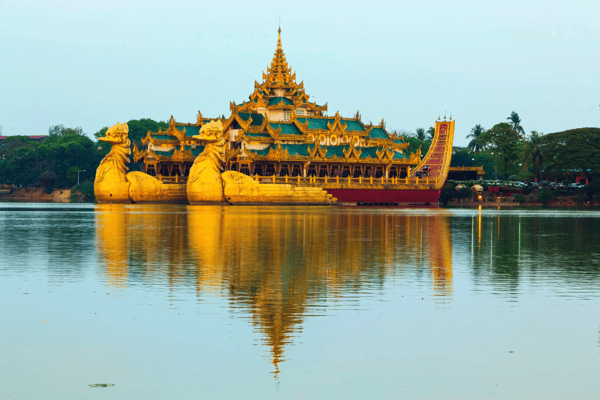 floating barge karaweik hall on kandawgyi lake at twilight yangon myanmar