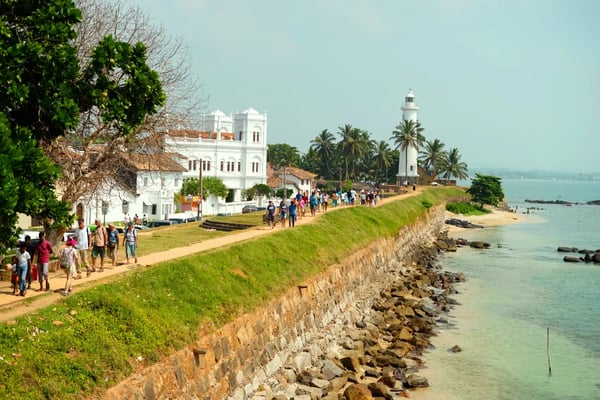 galle sri lanka people and tuk tuks on a road inside the ancient galle fort with the