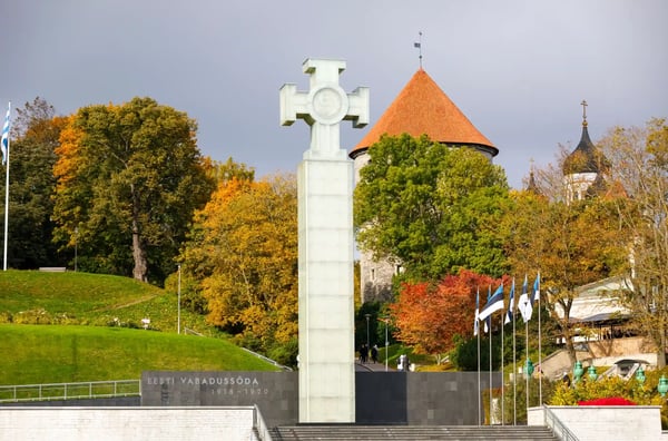 glass made statue of liberty and colorful trees in autumn in tallinn estonia