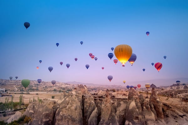 hot air balloons flying over beautiful goreme