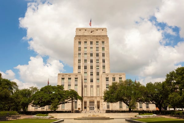 houston city hall building with fountain and flag texas 