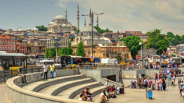 istambul turkey many people on the eminonu embankment near the galata bridge