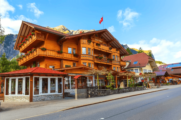 kandersteg switzerland view with colorful wooden house swiss flag and