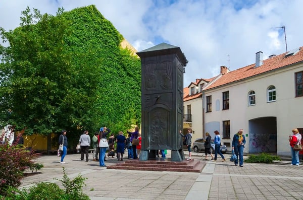 klaipeda lithuania unidentified tourists are near the sculpture bokshtas tower in the