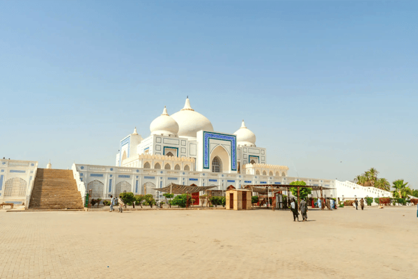 larkana bhutto family mausoleum picturesque view with visitors entering and exiting the shrine on pakistan