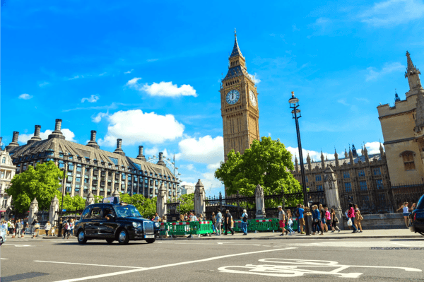 london united kingdom famous black cab and traffic near parliament westminster abbey