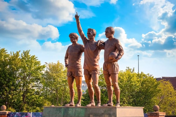manchester uk manchester uk the united trinity bronze sculpture which