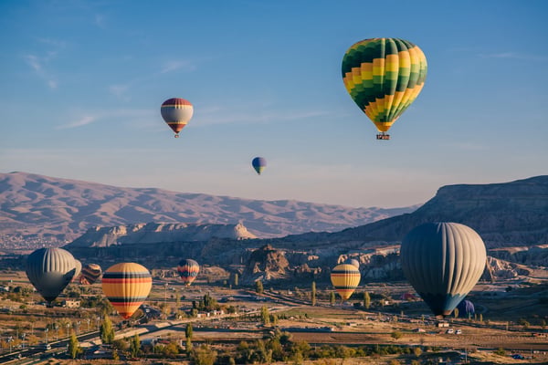 many balloons in sky in goreme national park