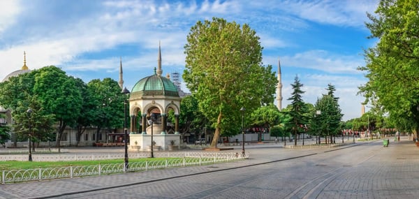 many tourists walk around sultan ahmet park on the site of a former 