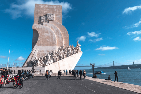 monument to the discoverers with bridge in lisbon portugal 