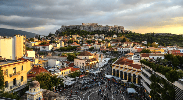 night scene of monastiraki square and ancient acropolis hill