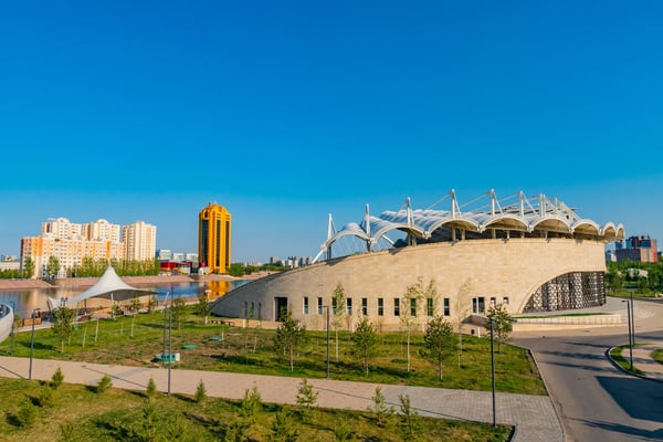 nur sultan astana ishim river promenade walking street view of amphitheater on a sunny blue sky