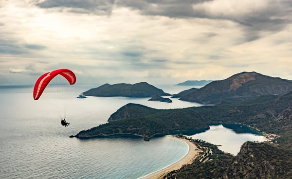 paraglider flying on oludeniz beach in fethiye