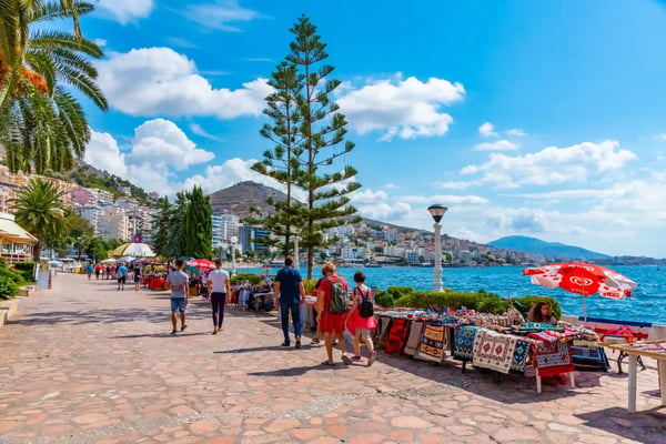 people are walking on seaside promenade