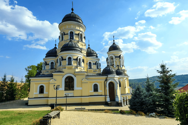photo of capriana monastery in moldova with blue sky