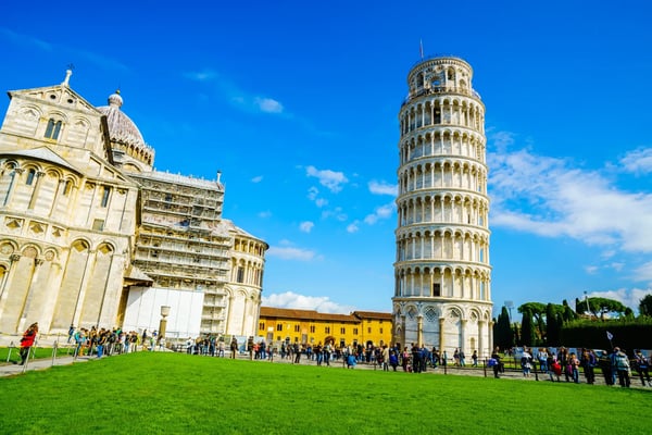 pisa italy crowd of tourists visit the famous buildings in the square of miracles at