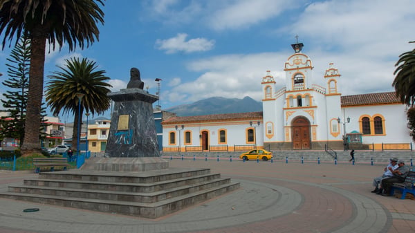 quito pichincha ecuador people sitting in the central park with the quiroga church