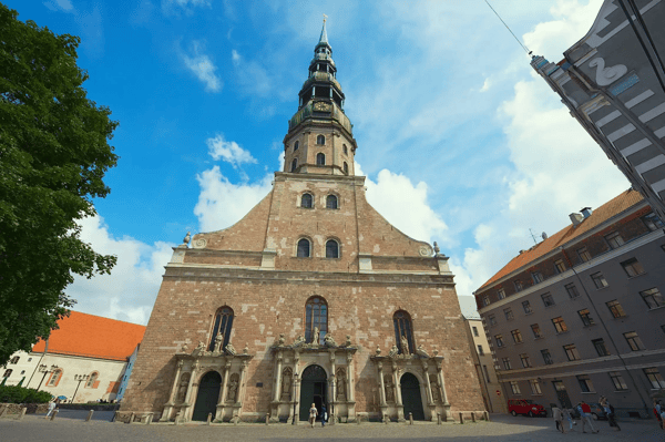 riga latvia st peter s church and historical building on a sunny summer day