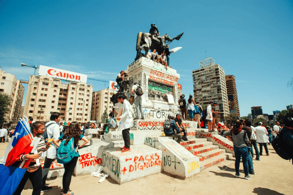 santiago chile demonstrators gather at the monument to general baquedano to begin