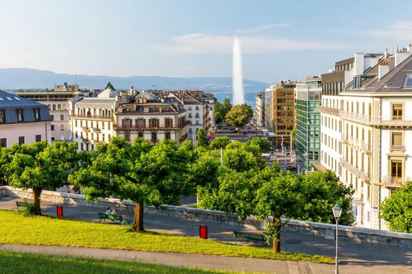 tall fountain called jet d eau above the old town of geneva