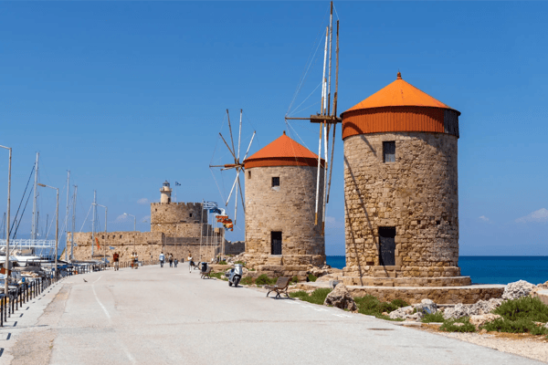 the historic windmills at the mandraki harbor in rhodes town