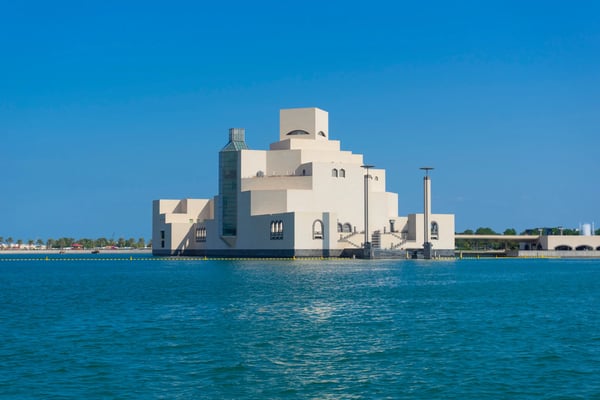 the museum of islamic art mia with a blue sky during the winter time in doha qatar