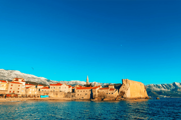 the old town of budva mountains covered with snow montenegro