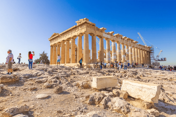 tourists near parthenon temple in acropolis in athens