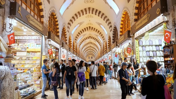 tourists walks between different shops and stores