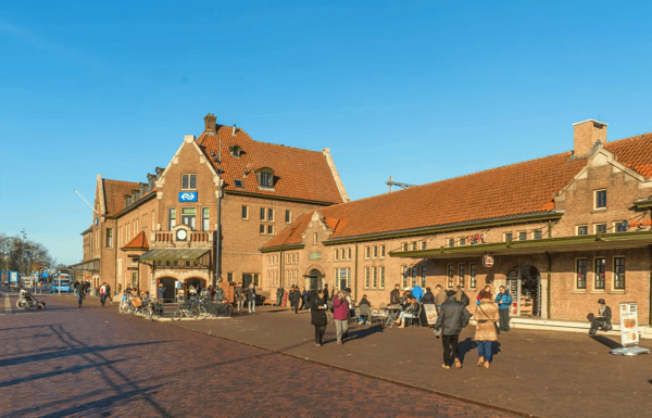 train station with passengers entering and leaving during wintertime