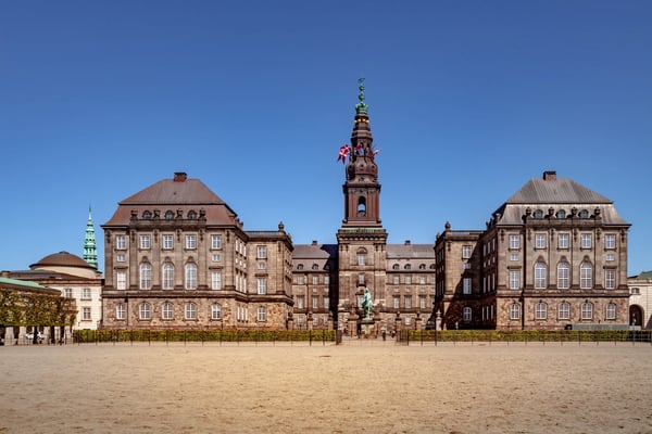 urban scene with historical christiansborg palace and blue sky in copenhagen denmark