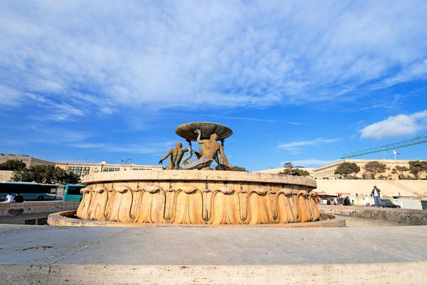 valletta malta the triton fountain in the city gate square of valletta malta on april