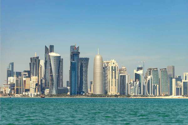 view of city center with skyscrapers from the other side of sea in doha qatar