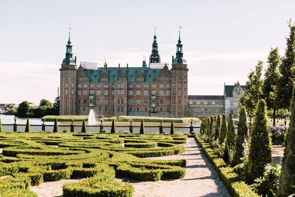 view of frederiksborg castle in hillerod denmark surrounded by manicured gardens